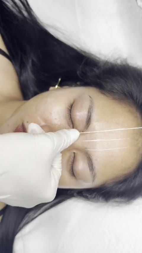 Kate Kanner mapping brows with a thread before ombre powder brows, Makati